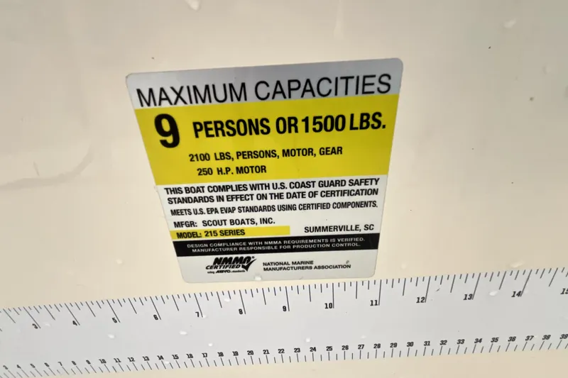 Slide: The Image of 2023 Scout 215 XSF capacity label: 9 persons or 1500 lbs, 250 HP motor. - 7