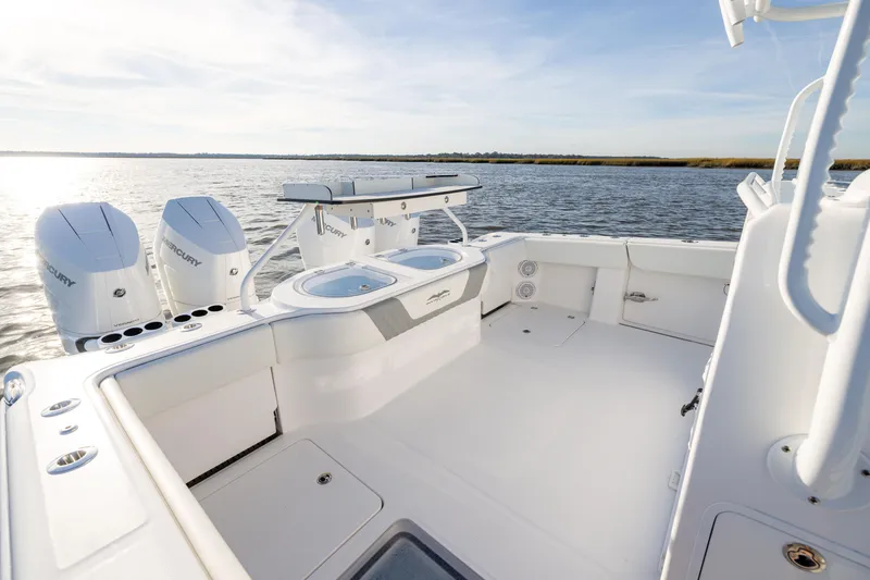 Slide: The Image of 2024 Invincible 40 Catamaran with dual Mercury engines on open water. - 21