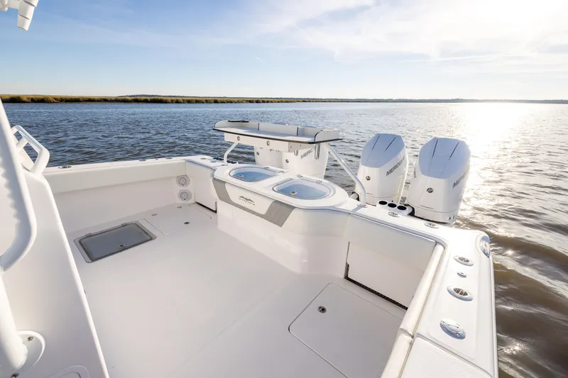 Slide: The Image of 2024 Invincible 40 Catamaran with dual engines on calm water, showcasing spacious deck. - 22