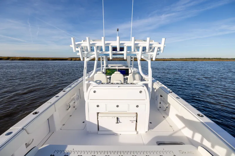 Slide: The Image of 2024 Invincible 40 Catamaran on calm water, showcasing spacious deck and modern design. - 23