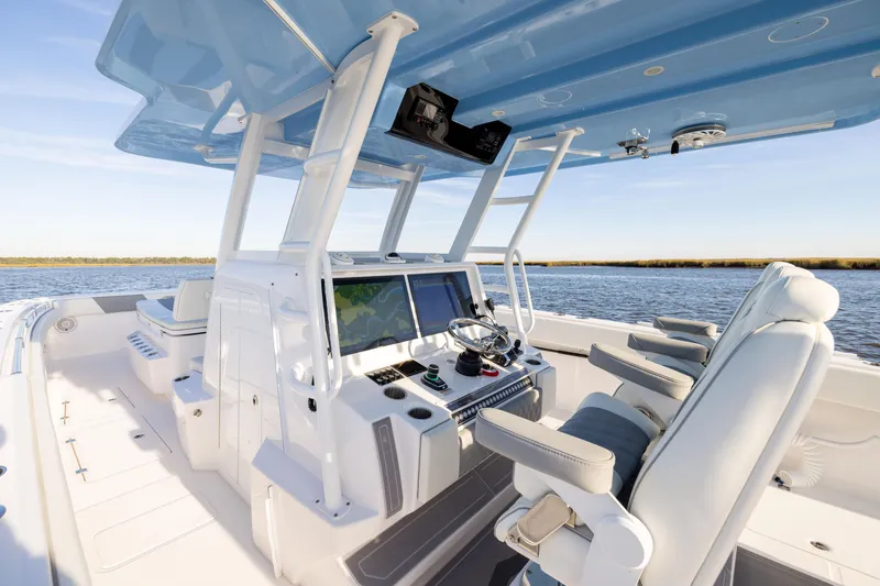 Slide: The Image of 2024 Invincible 40 Catamaran interior with advanced navigation system and luxurious seating. - 31