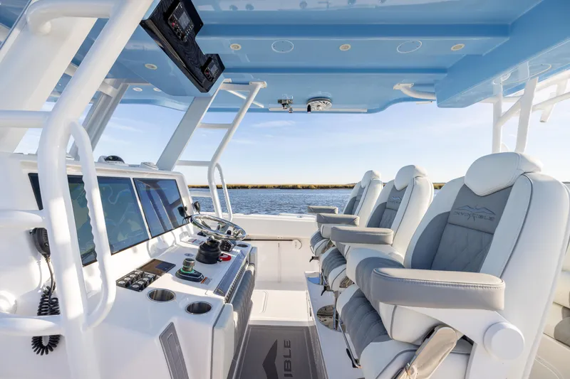 Slide: The Image of Interior of 2024 Invincible 40 Catamaran with modern helm and luxurious seating. - 37