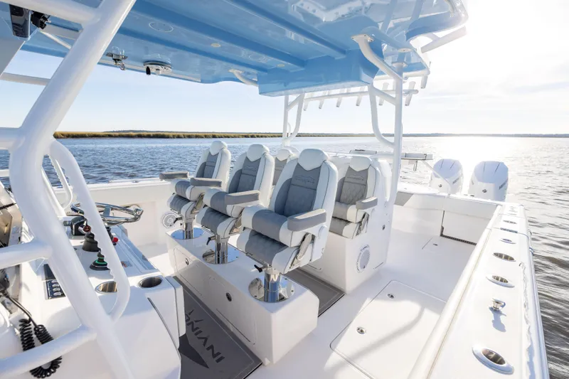 Slide: The Image of 2024 Invincible 40 Catamaran interior with luxurious seating and modern controls on open water. - 38