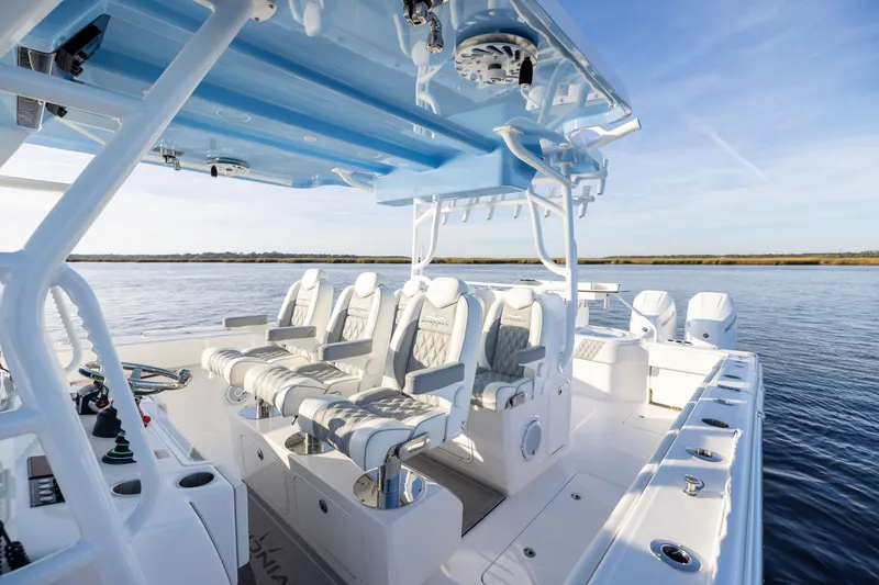 Slide: The Image of 2024 Invincible 40 Catamaran interior with luxurious seating on calm waters. - 39