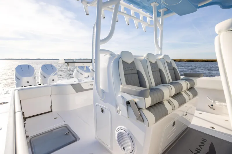 Slide: The Image of 2024 Invincible 40 Catamaran interior with luxurious seating and powerful outboard engines. - 43