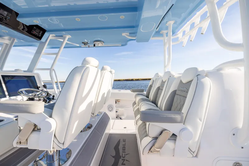 Slide: The Image of 2024 Invincible 40 Catamaran interior with luxurious seating and modern helm design. - 45