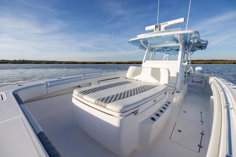 Slide: The Image of 2024 Invincible 40 Catamaran on calm water, showcasing luxurious seating and sleek design. - 46