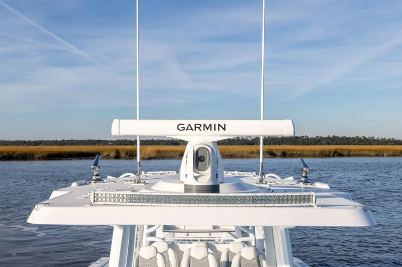 Slide: The Image of 2024 Invincible 40 Catamaran with Garmin radar on calm water. - 47