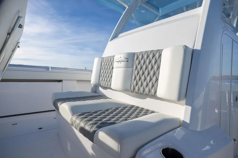 Slide: The Image of Luxurious seating on 2024 Invincible 40 Catamaran, featuring diamond-stitched upholstery. - 51
