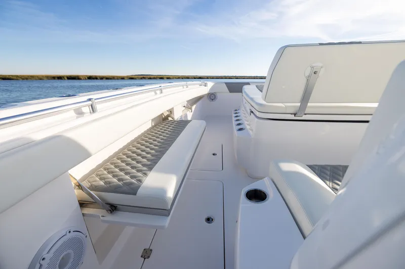 Slide: The Image of 2024 Invincible 40 Catamaran interior with luxurious seating and sleek design on open water. - 55