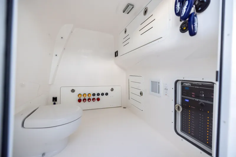 Slide: The Image of Interior of 2024 Invincible 40 Catamaran featuring control panel and modern amenities. - 56