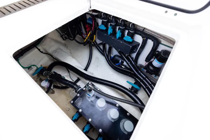 Slide: The Image of Engine compartment of 2024 Invincible 40 Catamaran, showcasing wiring and components. - 64
