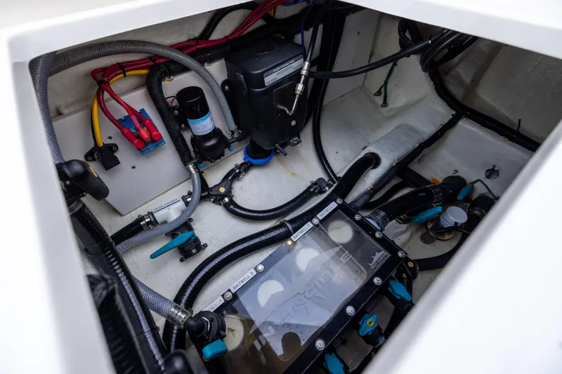 Slide: The Image of Engine compartment of 2024 Invincible 40 Catamaran showcasing wiring and components. - 66