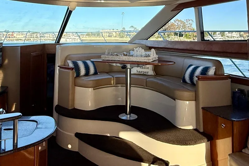 Slide: The Image of Luxurious interior of a 2006 Meridian 391 Sedan yacht with elegant seating and panoramic windows. - 11