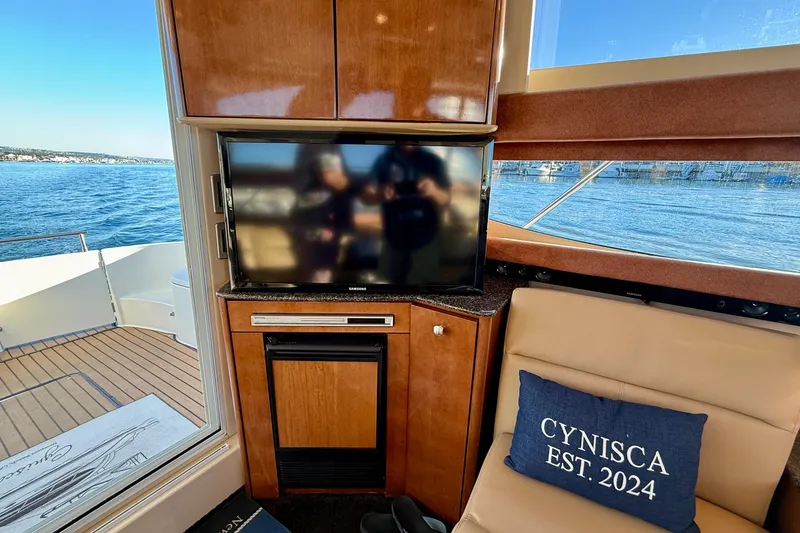 Slide: The Image of Interior of 2006 Meridian 391 Sedan yacht with TV, cushion, and ocean view. - 12