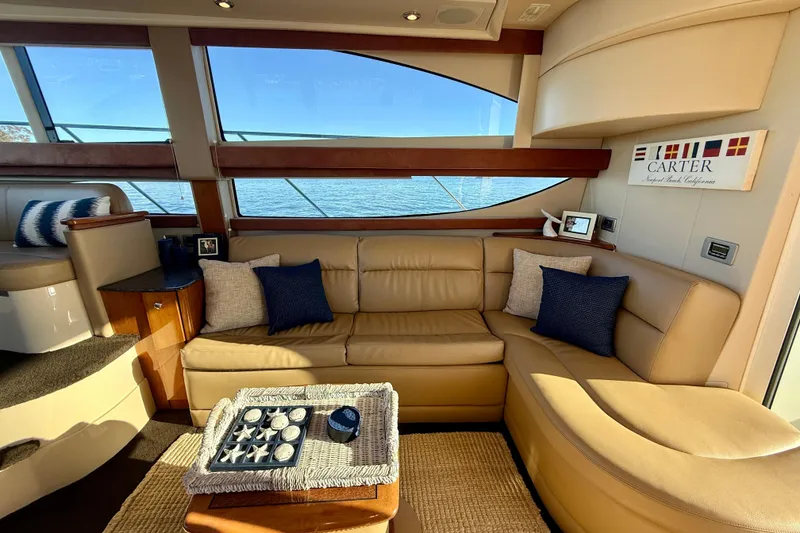 Slide: The Image of Luxurious interior of a 2006 Meridian 391 Sedan yacht with beige leather seating. - 14