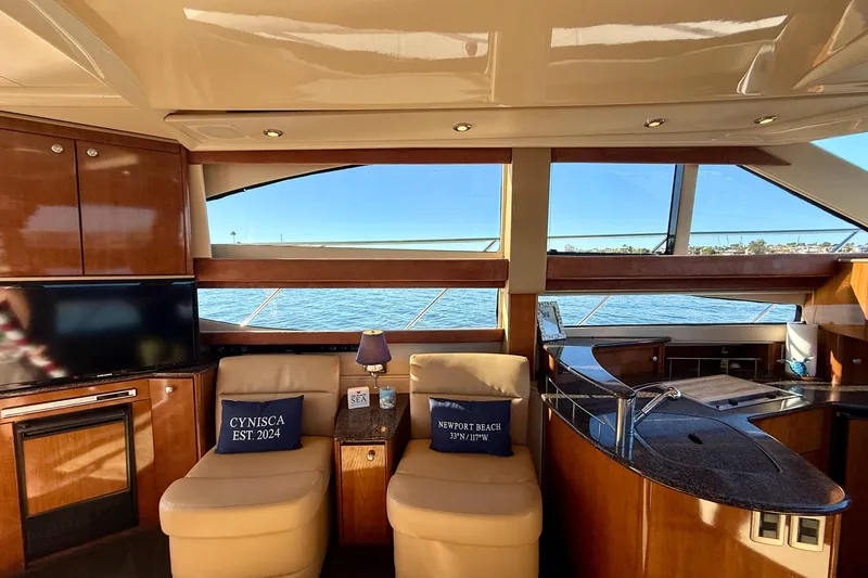 Slide: The Image of Luxurious interior of 2006 Meridian 391 Sedan yacht with ocean view and elegant furnishings. - 15