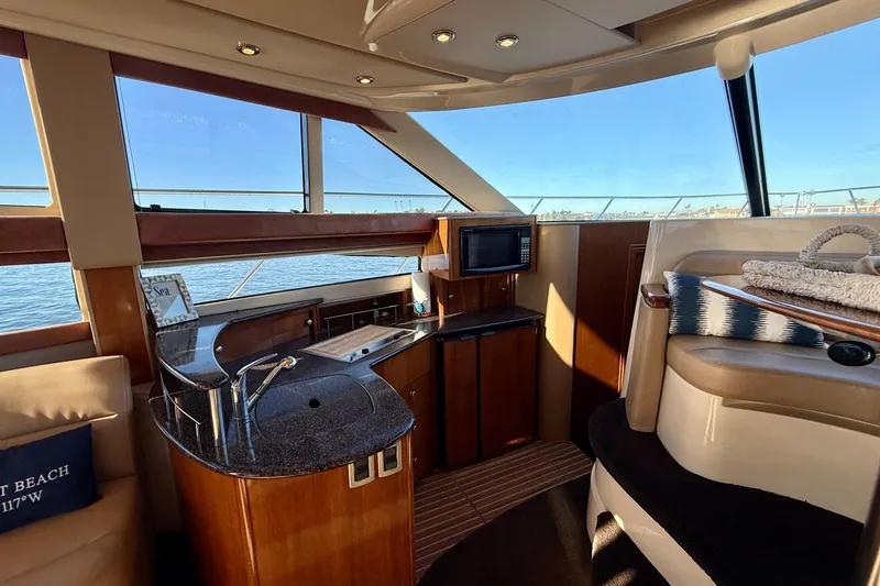 Slide: The Image of Luxurious interior of 2006 Meridian 391 Sedan yacht with modern amenities and scenic views. - 17