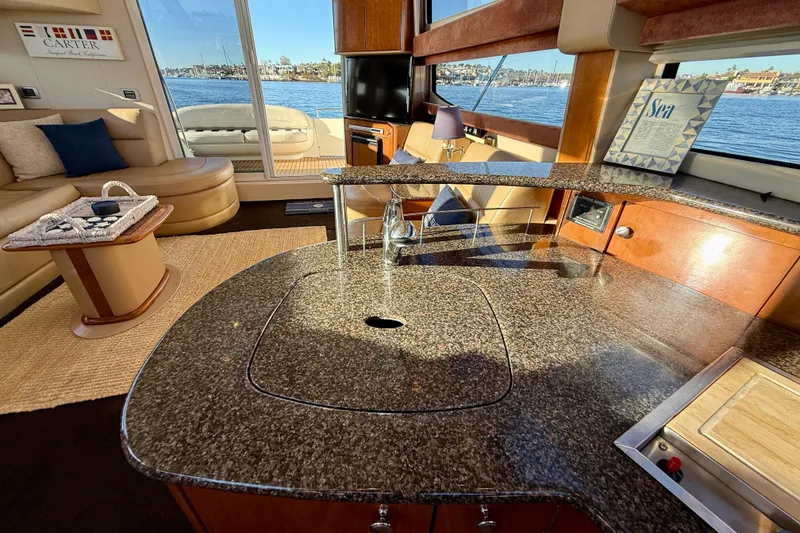 Slide: The Image of Luxurious interior of 2006 Meridian 391 Sedan yacht with elegant seating and granite countertops. - 22