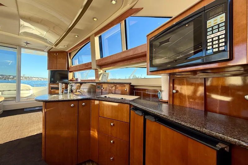 Slide: The Image of Luxurious interior of 2006 Meridian 391 Sedan yacht with modern kitchen amenities. - 24