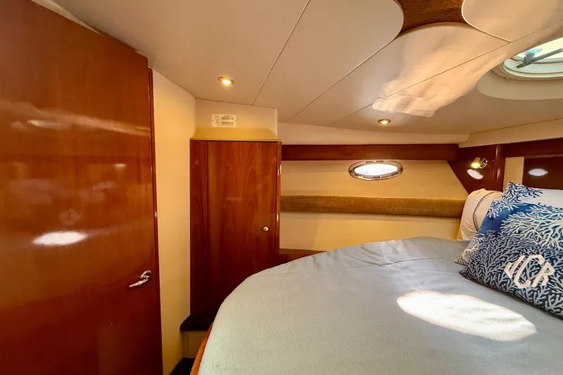 Slide: The Image of Luxurious 2006 Meridian 391 Sedan cabin interior with wood finishes and cozy bedding. - 26