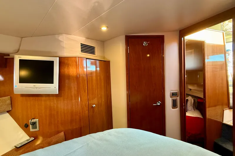 Slide: The Image of Interior of 2006 Meridian 391 Sedan yacht with TV and wooden cabinetry. - 27