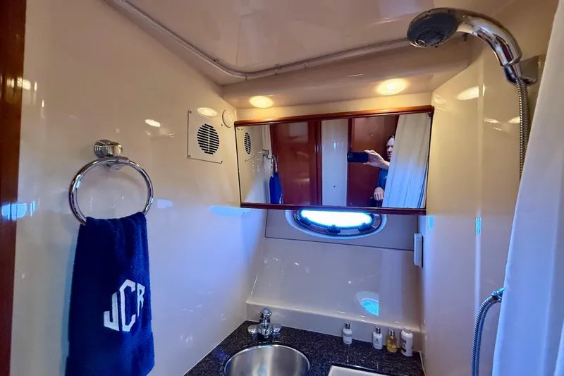 Slide: The Image of Bathroom interior of 2006 Meridian 391 Sedan yacht with mirror and sink. - 32