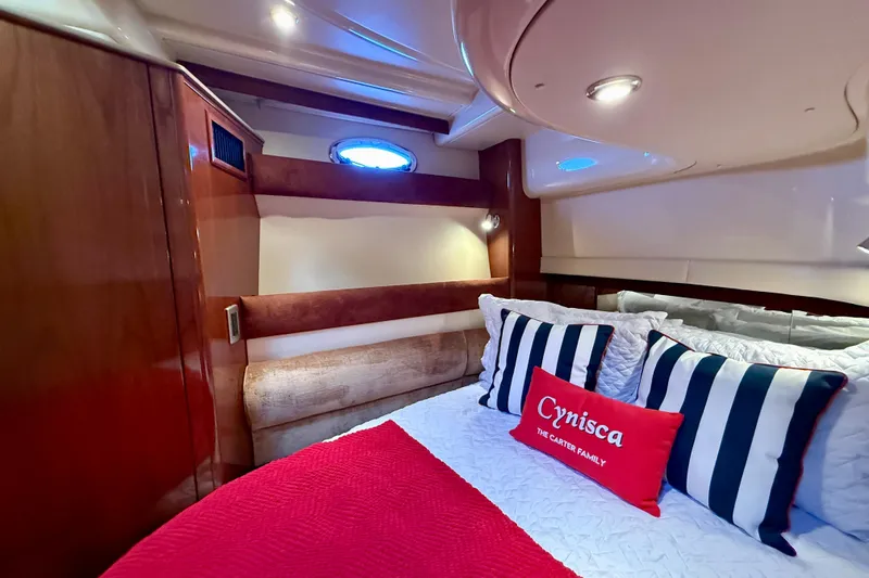 Slide: The Image of Luxurious cabin interior of 2006 Meridian 391 Sedan yacht with striped pillows. - 34