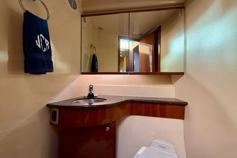 Slide: The Image of Luxurious bathroom in 2006 Meridian 391 Sedan yacht with elegant wood and granite finishes. - 35