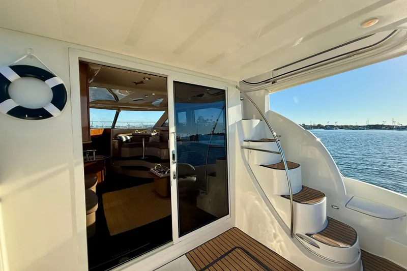 Slide: The Image of 2006 Meridian 391 Sedan yacht interior with spiral staircase and ocean view. - 36