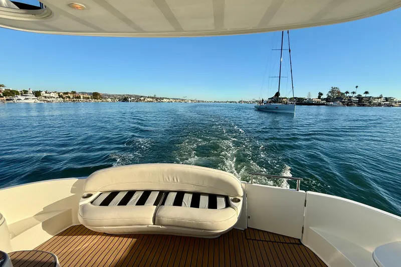 Slide: The Image of 2006 Meridian 391 Sedan cruising on a sunny day, with scenic waterfront views. - 40