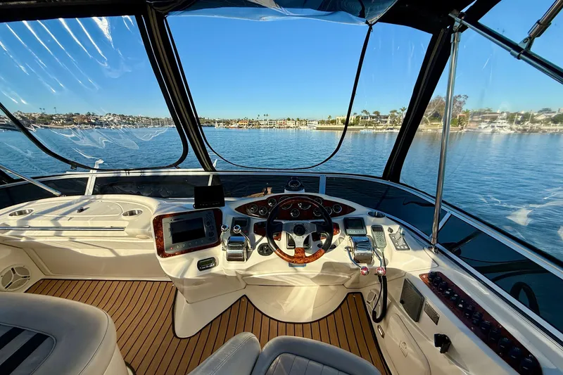 Slide: The Image of Interior view of 2006 Meridian 391 Sedan yacht cockpit with scenic waterfront. - 43