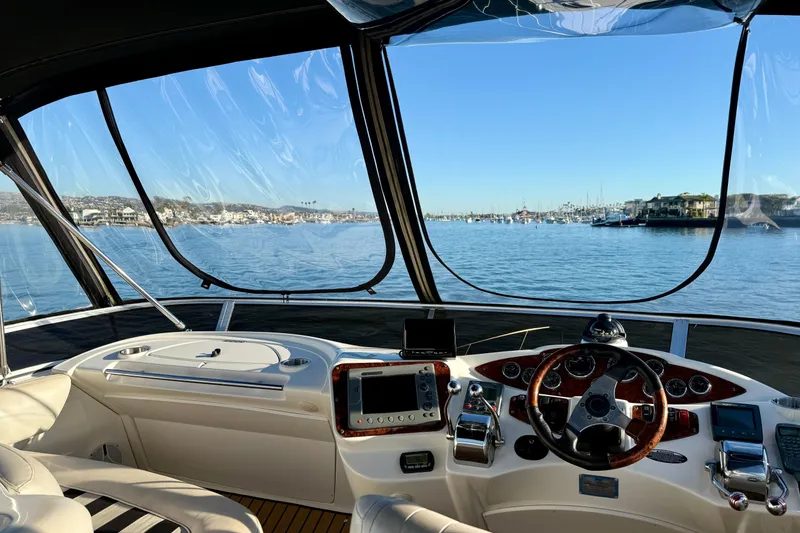 Slide: The Image of Interior view of 2006 Meridian 391 Sedan yacht cockpit overlooking marina. - 46