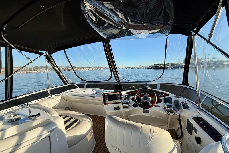 Slide: The Image of Interior view of 2006 Meridian 391 Sedan yacht helm with panoramic water view. - 47