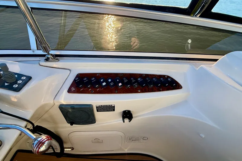 Slide: The Image of Control panel of a 2006 Meridian 391 Sedan boat with water reflection. - 50