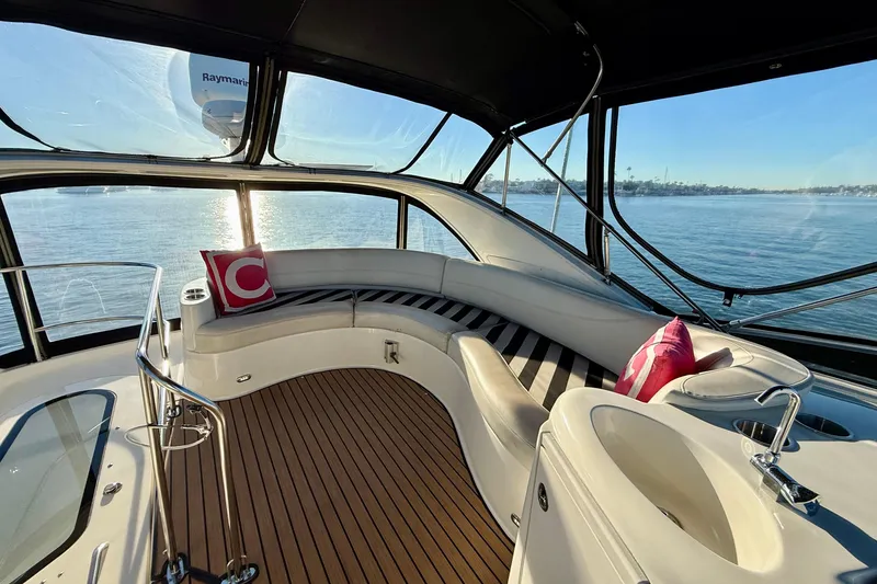 Slide: The Image of Luxurious 2006 Meridian 391 Sedan yacht interior with elegant seating and scenic ocean view. - 54