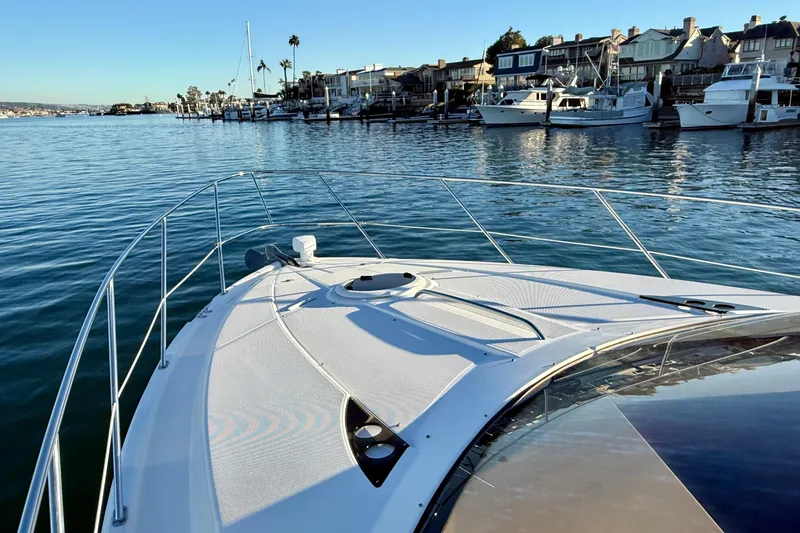 Slide: The Image of Bow view of 2006 Meridian 391 Sedan yacht in a marina setting. - 60