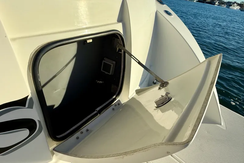Slide: The Image of Open hatch on 2006 Meridian 391 Sedan yacht, revealing interior storage space. - 62