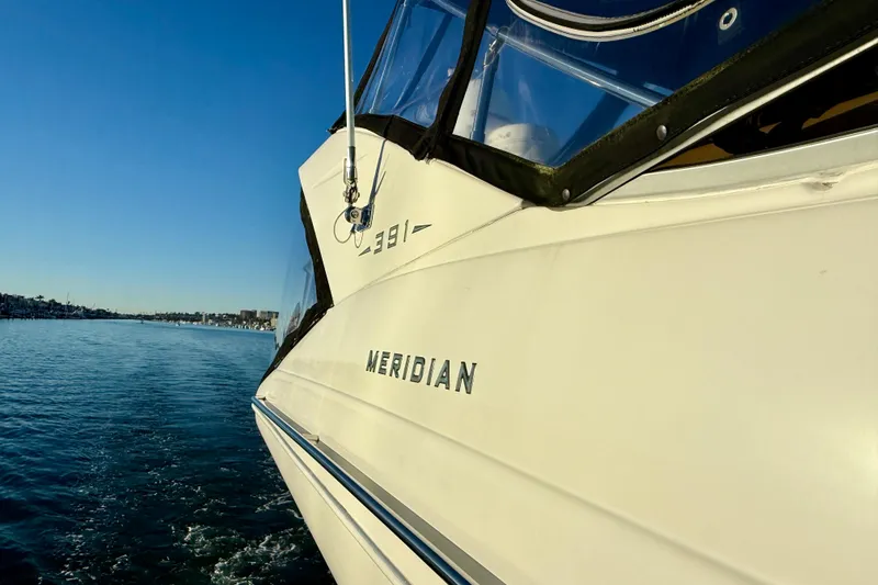 Slide: The Image of 2006 Meridian 391 Sedan yacht cruising on calm blue waters. - 63
