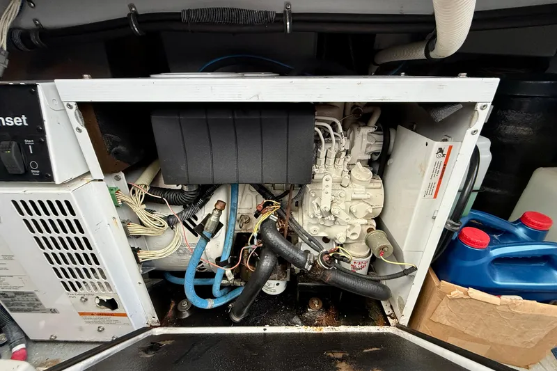 Slide: The Image of Engine compartment of a 2006 Meridian 391 Sedan, showcasing mechanical components and wiring. - 68