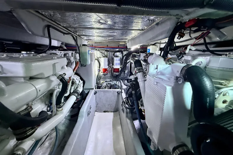 Slide: The Image of Engine room of 2006 Meridian 391 Sedan yacht, showcasing mechanical components and systems. - 69