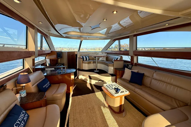 Slide: The Image of Luxurious interior of a 2006 Meridian 391 Sedan yacht with elegant seating and panoramic windows. - 7