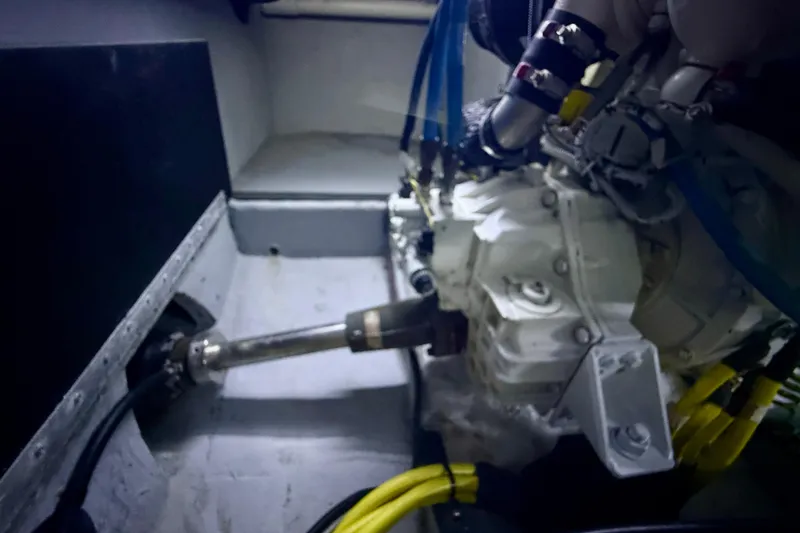 Slide: The Image of Engine compartment of a 2006 Meridian 391 Sedan boat, featuring mechanical components and wiring. - 73