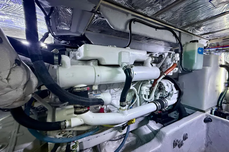 Slide: The Image of Engine room of a 2006 Meridian 391 Sedan yacht, showcasing mechanical components. - 74