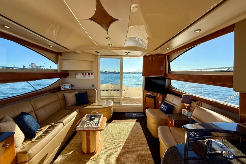 Slide: The Image of Luxurious interior of a 2006 Meridian 391 Sedan yacht with elegant seating and scenic water views. - 8