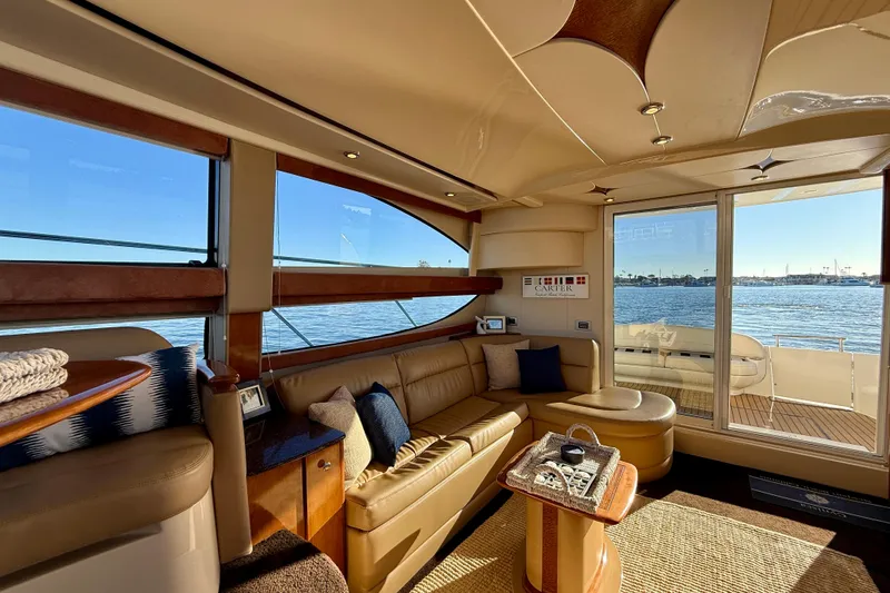 Slide: The Image of Luxurious interior of 2006 Meridian 391 Sedan yacht with waterfront view. - 9