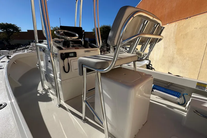 Slide: The Image of 2023 Parker 1801 Center Console boat interior with steering and seating area. - 10