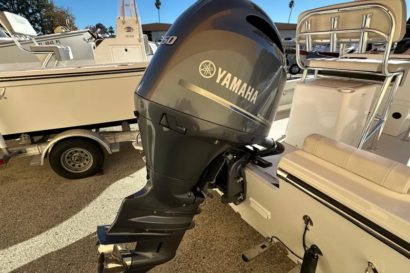Slide: The Image of 2023 Parker 1801 Center Console with Yamaha outboard motor, parked on a trailer. - 14