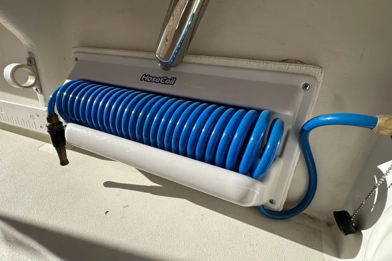 Slide: The Image of Coiled blue hose on 2023 Parker 1801 Center Console boat. - 15