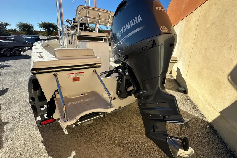 Slide: The Image of 2023 Parker 1801 Center Console boat with Yamaha 150 engine, rear view. - 16